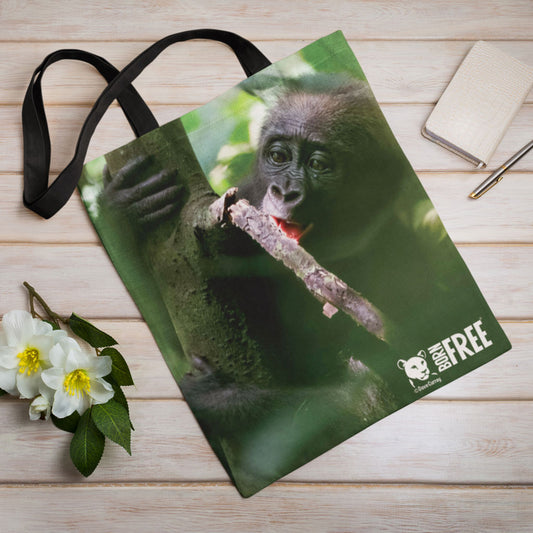 Baby chewing on a small branch Edge-to-Edge Tote Bag