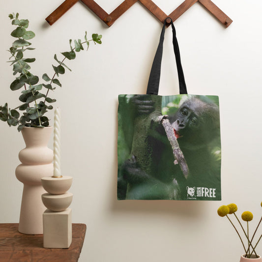 Baby chewing on a small branch Tote Bag by Dave Currey